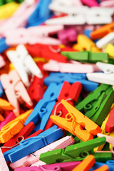 Colorful Wooden clothespins close-up as texture and background.