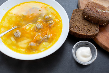 Top view of plate with meatballs soup, traditional plate of the Romanian cuisine