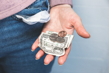 One dollar and petty cash only, empty pocket. No money. Economy crisis, poverty, unemployment concept. Consequences of coronavirus people isolation during quarantine. Inflation rates. Price growth. 