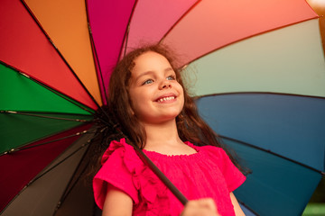 Happy child with colorful umbrella