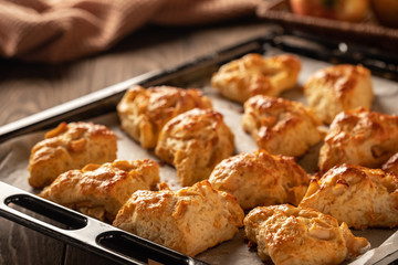 Tasty, fragrant and tender scones with apples from the oven close-up