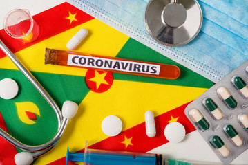 Coronavirus, nCoV concept. Top view protective breathing mask, stethoscope, syringe, tablets on the...