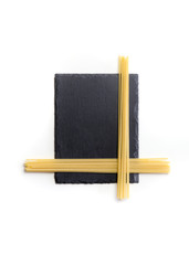 Spaghetti isolated on a black plate