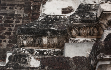 Stone carving detail of ancient temple. Fragment with ethnic ornament