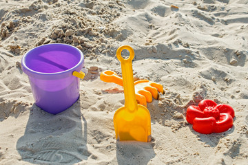 Fototapeta na wymiar Baby bucket. Games in the sand. Sandbox. Beach. Sandbox Games