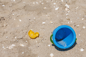 Fototapeta na wymiar Baby bucket. Games in the sand. Sandbox. Beach