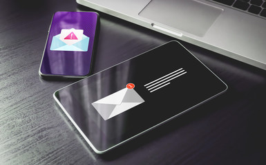 Malware Spreading Virus, Spam Distribution - smartphone and tablet pc with mail notification alert and warning message icon. Irrelevant unsolicited malicious software, scam, fraud e-mail concept.