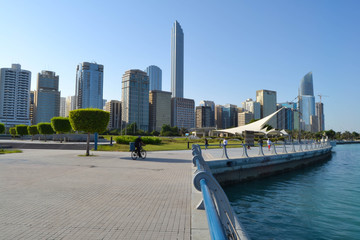 View of Abu Dhabi Cornish during the day tome with beautiful blue sky and blue sea. Luxury...