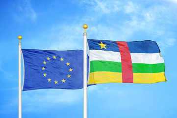 European Union and Central African Republic two flags on flagpoles and blue cloudy sky