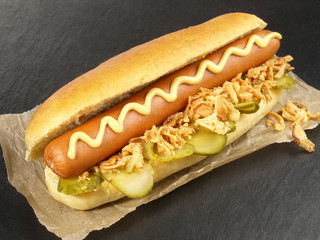 Self Made Classic Hot Dog with Mustard - Fast Food on black Background