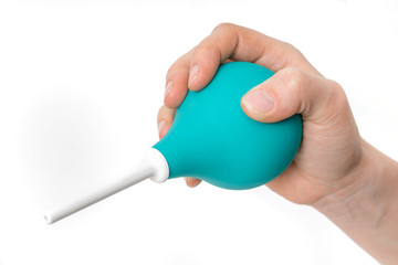 Enema in hand of doctor on white background