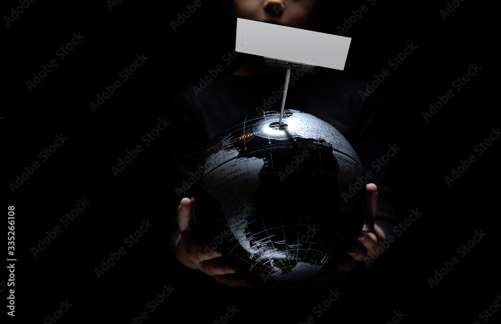 Wall mural kid hands hold globe with empty mock up on black background