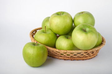 Perfect fresh green Apple with lemon isolated on a white background in full depth of field with a cropped trajectory.