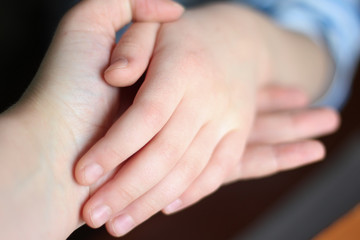 tender hands of mother and daughter