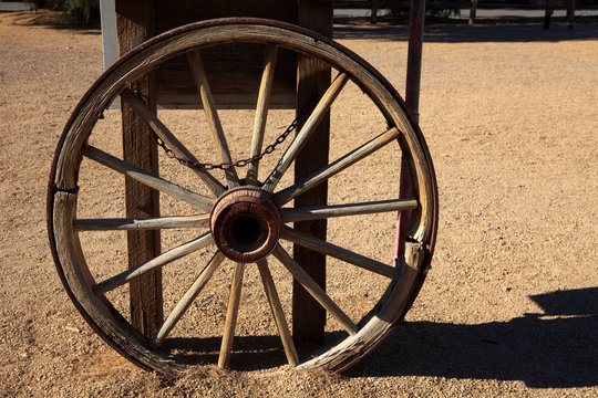California / USA - August 22, 2015: A wooden wagon wheel in Death Valley National Park, California, USA