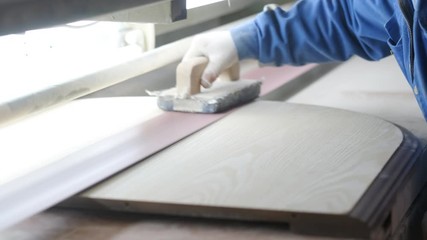 The joiner handles wooden products. 
Work in a carpentry workshop. Production of furniture.