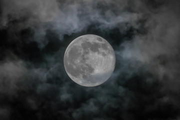 Naklejka na ściany i meble Full moon isolated over sky background