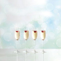 Champagne glasses with raspberry