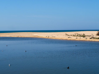 Fototapeta na wymiar Beautiful lagoon Lagoa dos Salgados near Albufeira in Portugal