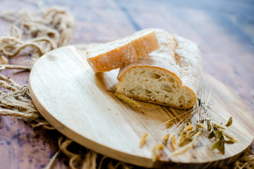 fresh baked bread on wooden background