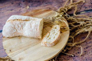 fresh baked bread on wooden background