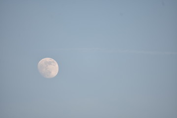 Full moon in the late afternoon in Berlin Germany