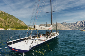 Sunny morning panoramic view of beautiful yacht at Kotor bay near old town, Montenegro.