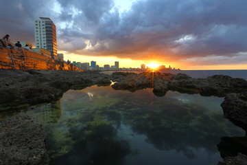 Sunset at Malecon, the famous Havana promenades, Havana, Cuba - 335283152