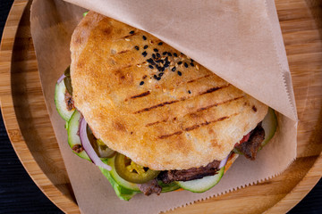 Beef pieces fried on trochanter with parsley and dill with pickles in a tortilla cooked in tandem