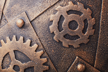 Rusty metal sheet wall with three borders of metal spikes, with orange and brown scratches and...