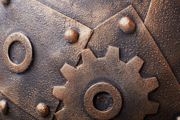 Rusty metal sheet wall with three borders of metal spikes, with orange and brown scratches and scuffs. Suitable for Wallpaper or background or grunge texture.Steampunk texture, background with mechani