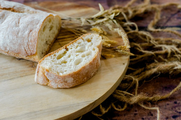 fresh baked bread on wooden background