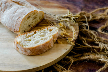fresh baked bread on wooden background