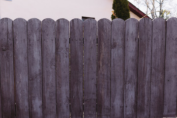 Fototapeta premium Closeup dark violet rough wood fence. Beautiful lilac not flat background. 