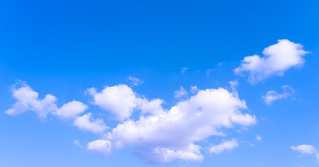 Large white clouds on a blue sky. Clear day. Background, blank for designers.