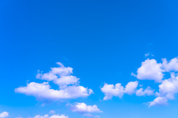 Large white clouds on a blue sky. Clear day. Background, blank for designers.