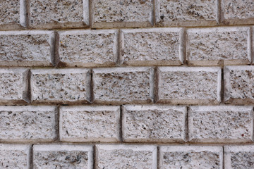 House wall element revetted with a natural stone. 