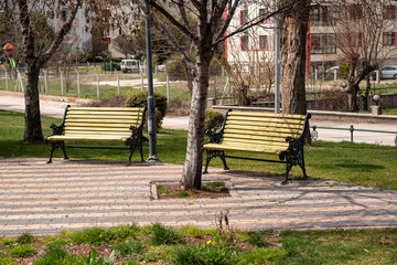 Empty benches at public park during curfew cause of Corona Virus quarantine in Eskisehir. Empty benches at public park during an outbreak of coronavirus. COVID-19 Pandemic Coronavirus concept.