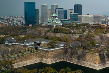 Fototapeta premium Aerial view of Osaka Castle and city skyline, Japan