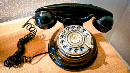 Close-up of vintage rotary dial telephone