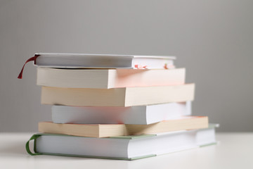 close up of a stack of books on the table