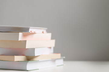close up of a stack of books on the table
