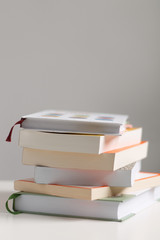 close up of a stack of books on the table