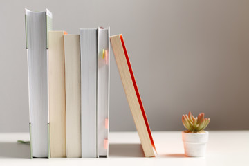 close up of a stack of books on the table
