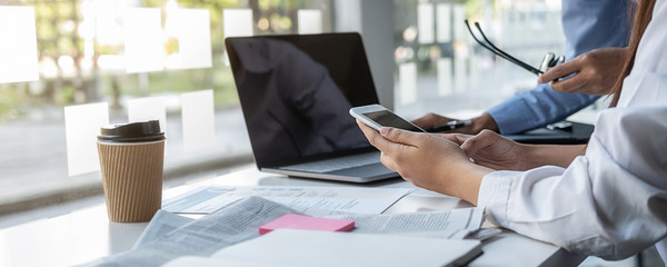 Young unemployed is searching for a job in the newspaper and laptop. Interview the job and hiring...