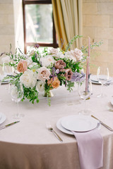 Table setting at a luxury wedding and Beautiful flowers on the table.