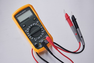 Digital multimeter with probes.