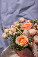 Spring bouquet of mixed flowers. Roses in a brides flower bouquet.