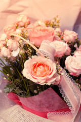 Spring bouquet of mixed flowers. Roses in a brides flower bouquet.