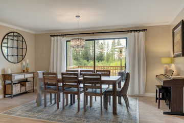 Luxury home dining room and kitchen interior with natural rustic modern deisgn.